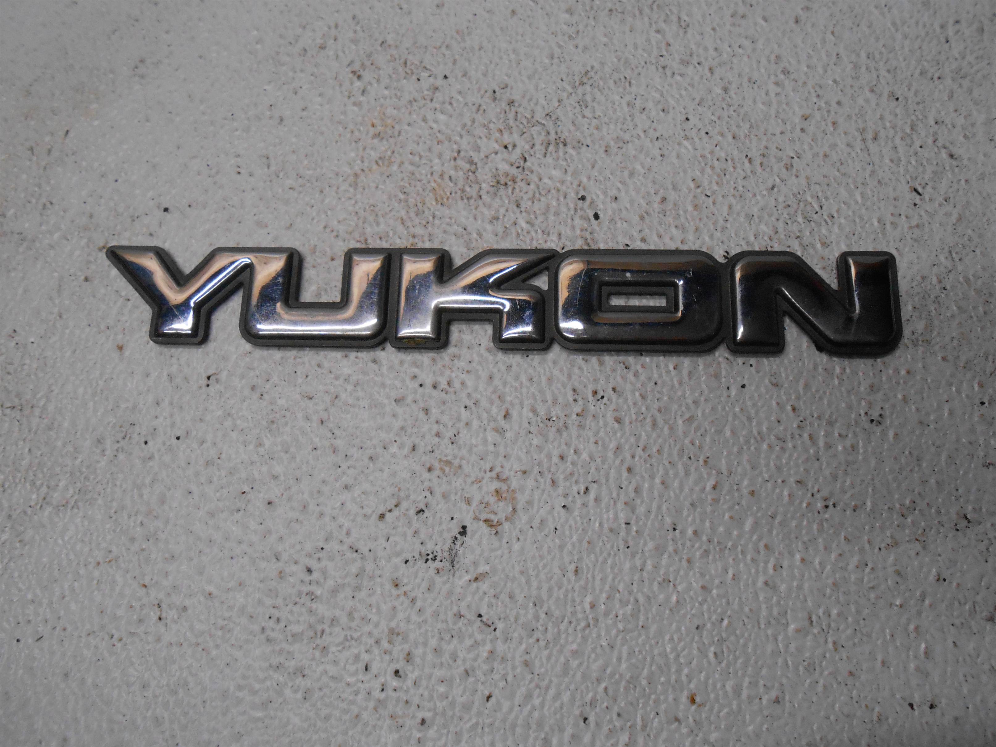 Used 2004 GMC Yukon Exterior Right RH Front Door Emblem for sale small view front thumbnail