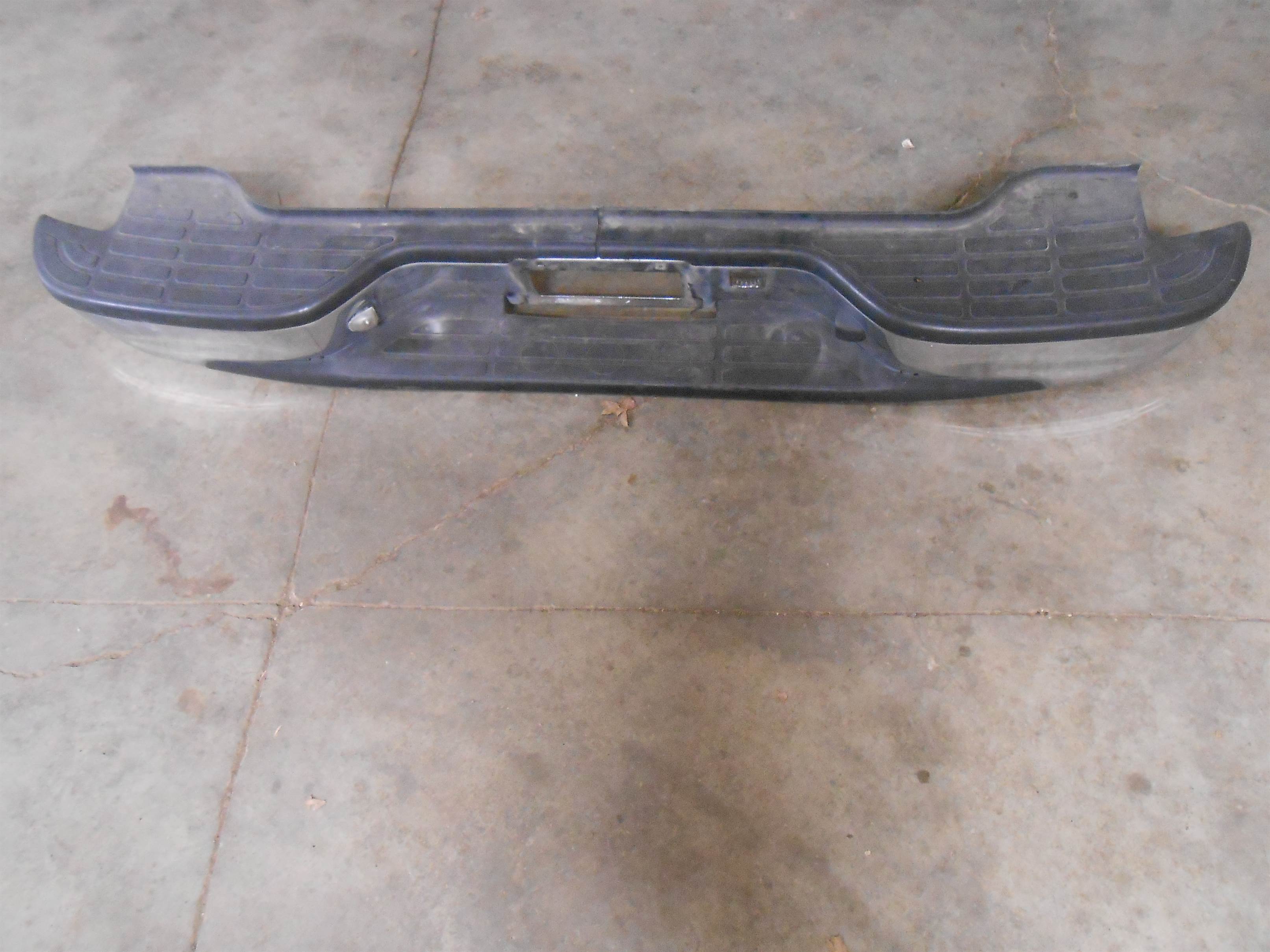 Used 2004 GMC Yukon Rear Bumper with Textured Step Board for sale small view front thumbnail